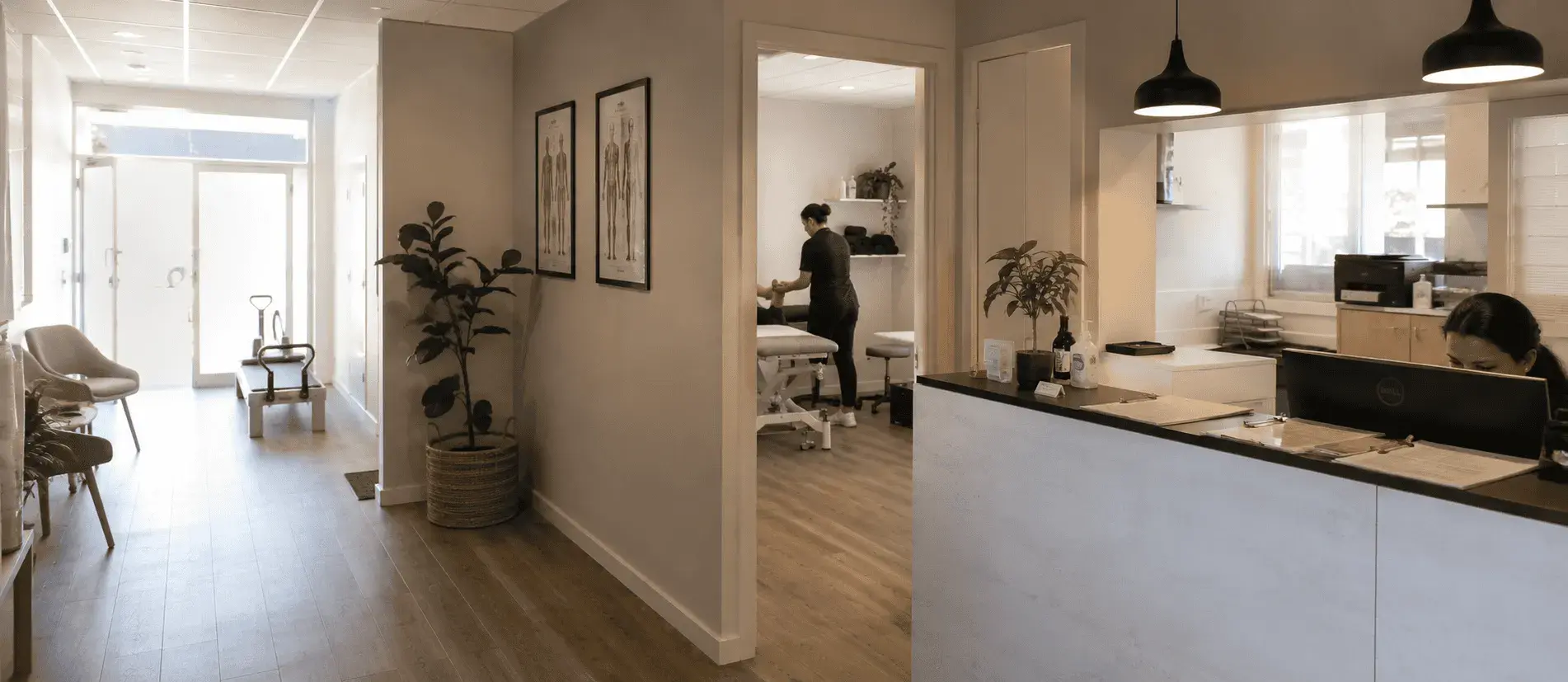 Reception desk and treatment rooms inside an allied health clinic, with a staff member working at the front counter